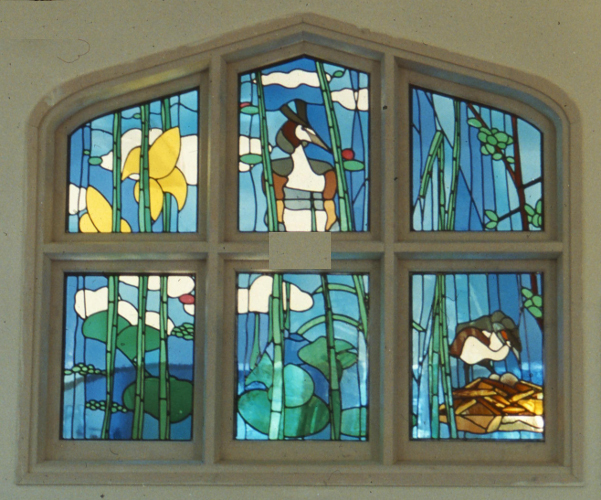 stained glass representation of grebes